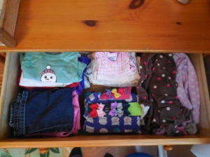 Enough clothes for 6 days: long and short sleeved shirts, pants, sleepwear, and hair bows.