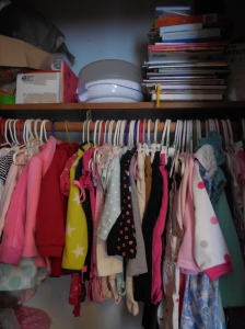 Clothes in the next size up, along with books more appropriate for an older child. The bottles in the box and bottle-steamer are being stored for the possibility of another child.